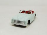 a toy car that is sitting on a white surface