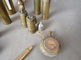 a lot of brass items that are on the table