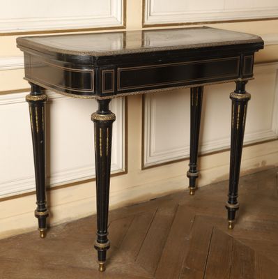 a black table with a marble top in a room
