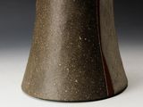 a close up of a vase on a table