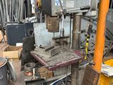 a machine that is sitting in the middle of a pile of junk