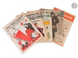 a lot of newspapers that are sitting on a table