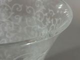 a glass bowl that is sitting on a table