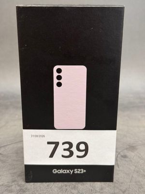 une boîte contenant un téléphone rose, posée sur une table