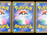 three cards with pokemon on them on a black background