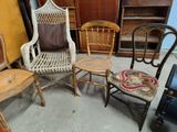 three chairs and a table in a room
