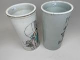 two cups sitting next to each other on a table