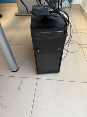 a computer on a desk with a lot of wires