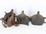 five vases sitting next to each other on a white surface
