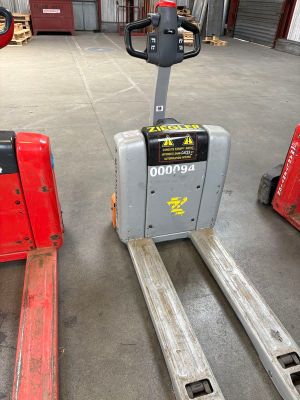 three forklifts in a warehouse with a red fork