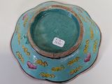 a blue bowl with a flower design on it