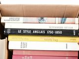a box full of books sitting on top of a table
