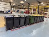 many bins lined up in a large warehouse