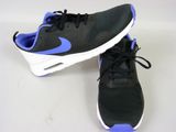 black and blue sneakers with white soles on a white surface