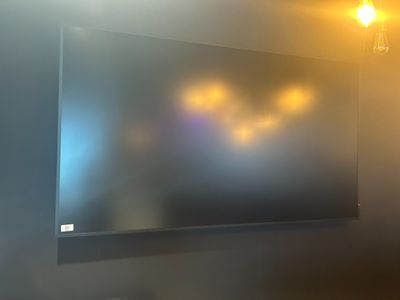 a picture of a flat screen tv hanging on a wall