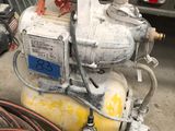 an image of a compressor with a hose attached to it