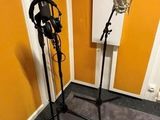 two microphones in a room with a yellow wall