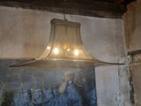 a picture of a man that is hanging from a light fixture