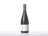 a close up of a bottle of wine on a table