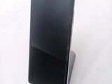a cell phone that is sitting on top of a stand