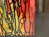 a picture of a picture of a painting in a glass case