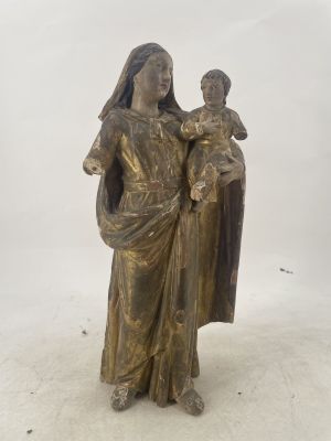 bronze statue of a woman holding a child in her arms
