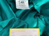 a close up of a blue dress with a price tag on it