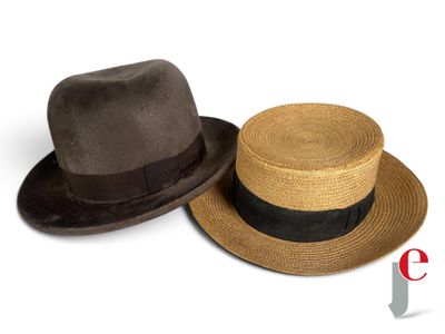 two hats that are sitting next to each other on a white surface