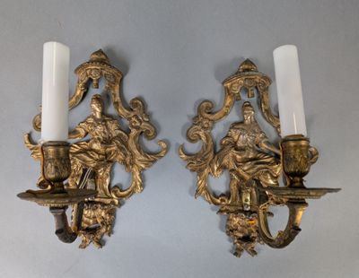 pair of antique brass wall sconces with figures and candles