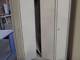 two metal cabinets sitting on pallets in a warehouse