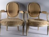 pair of antique chairs with upholstered back and arms