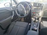 the interior of a car with a steering wheel and dashboard controls