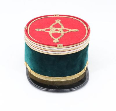a red and green box on a black stand