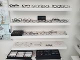 many glasses on the shelves in the store