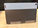 a tablet computer sitting on top of a wooden table