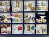 many different types of jewelry in a display case