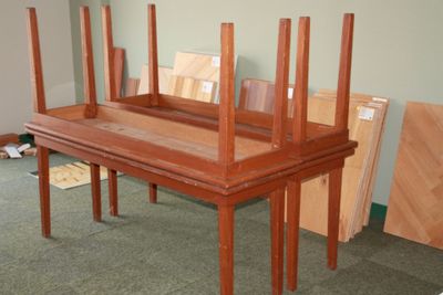 several pieces of wood are stacked on top of each other in a room