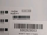 two labels on the back of a laptop computer