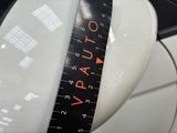 a close up of a measuring tape on a toilet seat