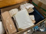 a cardboard box filled with lots of items on the floor