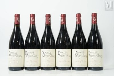 six bottles of wine are lined up in a row on a table