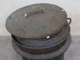 three pots sitting on top of each other on the ground