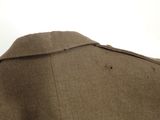a close up of a military jacket with buttons on the collar
