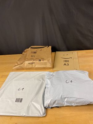 three bags of food sitting on a table next to each other