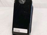 a cell phone that is sitting on top of a stand