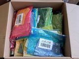 a box full of different colored plastic bags in it