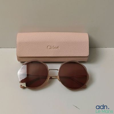 a close up of a pair of sunglasses on a table