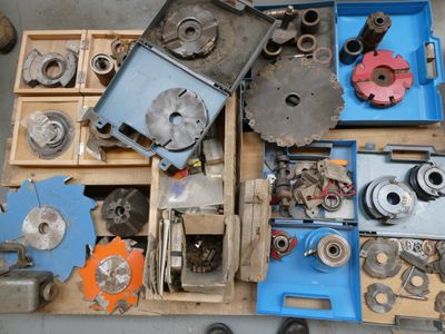 many different types of metal parts in a box