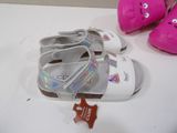 a pair of shoes and a tag on a table