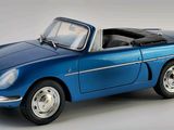 an image of a blue model car on a white background